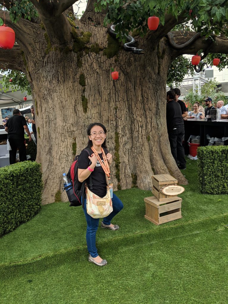 Founder/Editor ChinLin posing in front of a fake apple tree