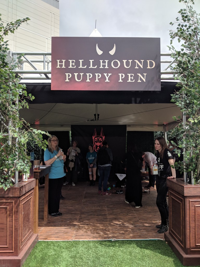 Hellhound Puppy Pen booth where Austin Animal Shelter allowed visitors to see adoptable puppies.