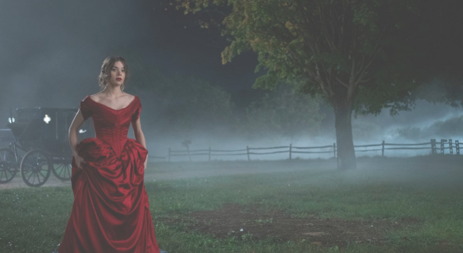 Hailee Steinfeld stars as Emily Dickinson in the Apple TV show, Dickinson. She wears a deep red dress on her way to meet with Death.
