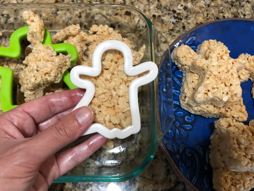 Use a ghost-shaped cookie cutter to "cut" your ghosts into the cooked Rice Krispy batter. 