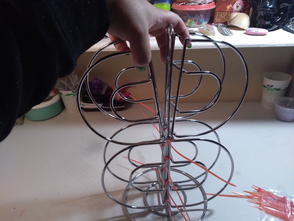 Melissa Joy holds the two other napkin holders in place on the paper towel holder.