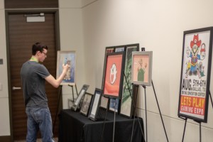 guy admires gaming art