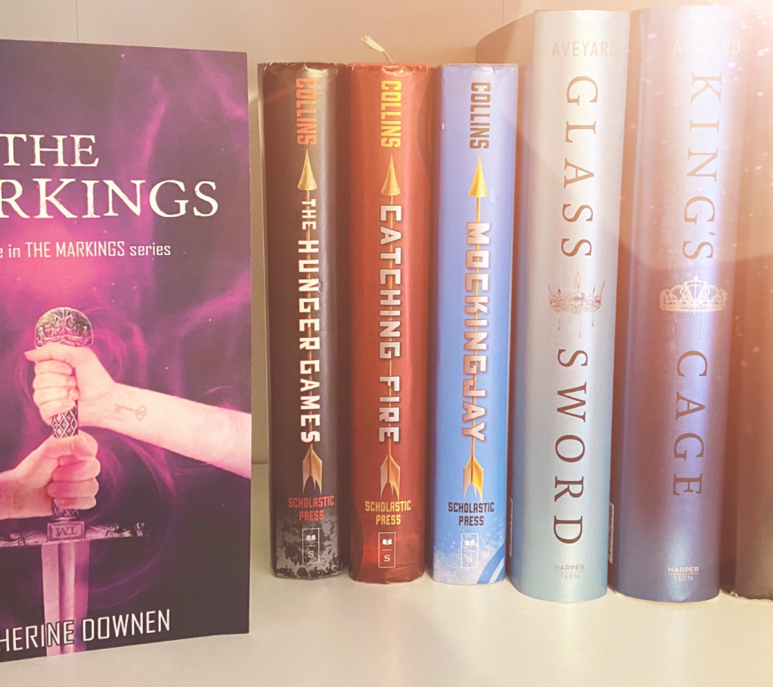 "The Markings" book on a shelf with other YA books