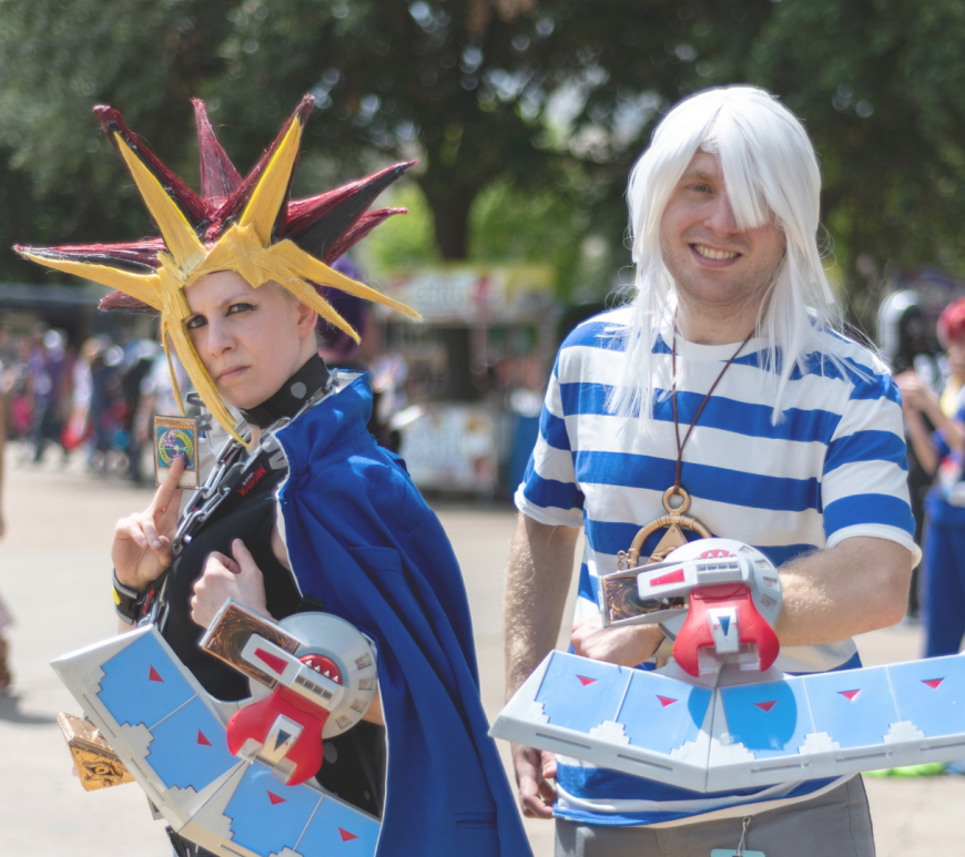 Two cosplayers cosplay as Yugi and Bakura from the anime series "Yu-Gi-Oh!" at A-Kon 2019.