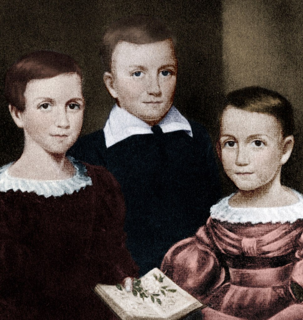 Emily, Austin, and Lavinia Dickinson stilling for a portrait as children