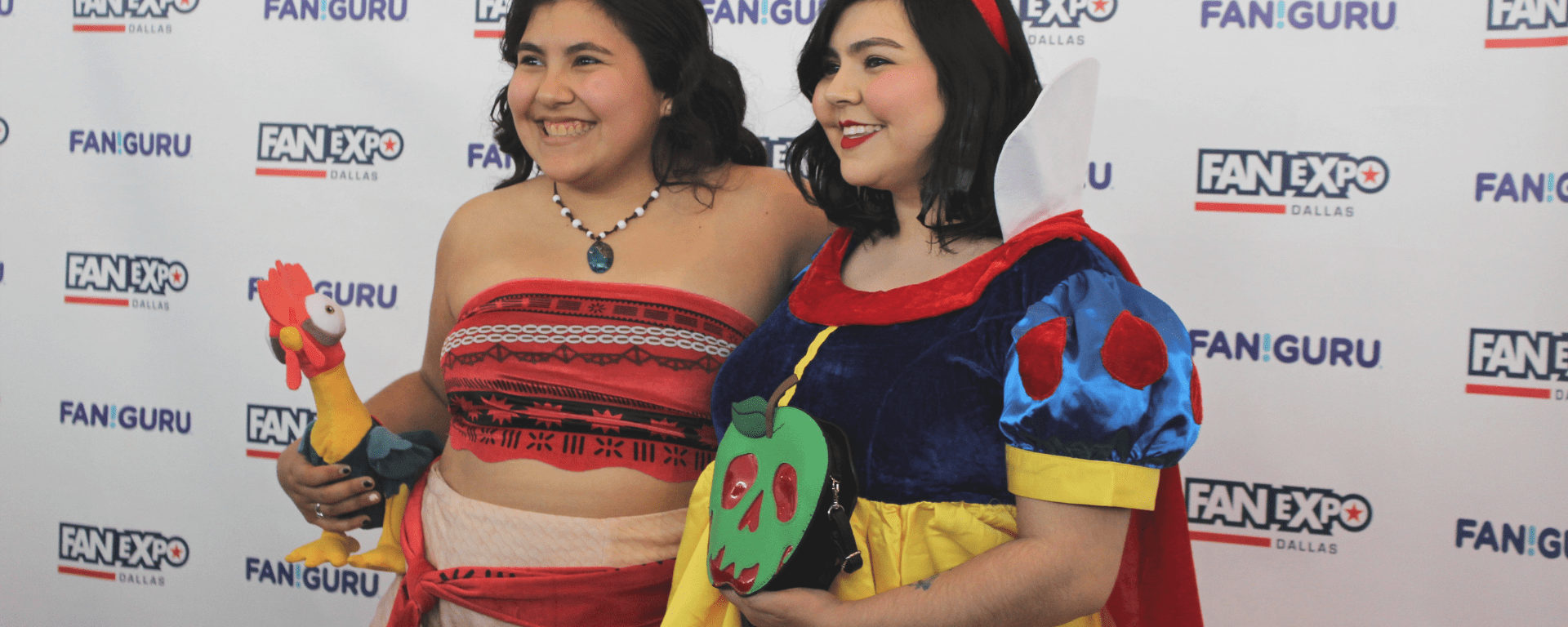 Cosplayers dress up as Moana and Snow White