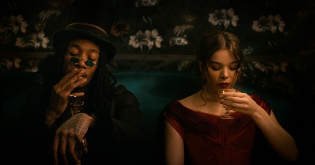 Wiz Khalifa guest starred as Death. He sits in his carriage taking a smoke while Emily Dickinson takes a sip of wine next to him.