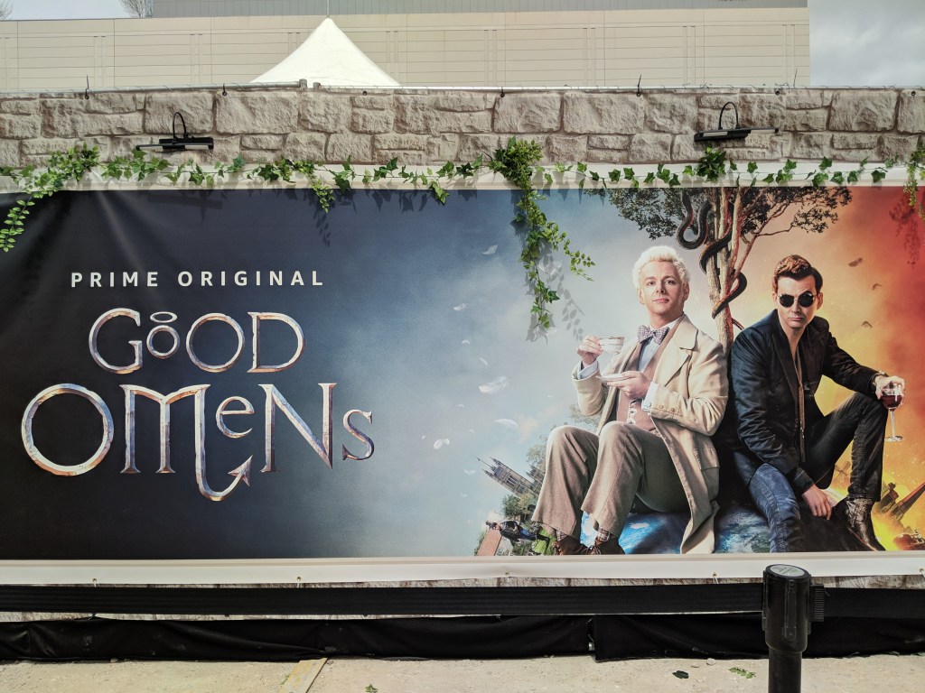 Good Omens official TV show poster outside the wall of the activation event.