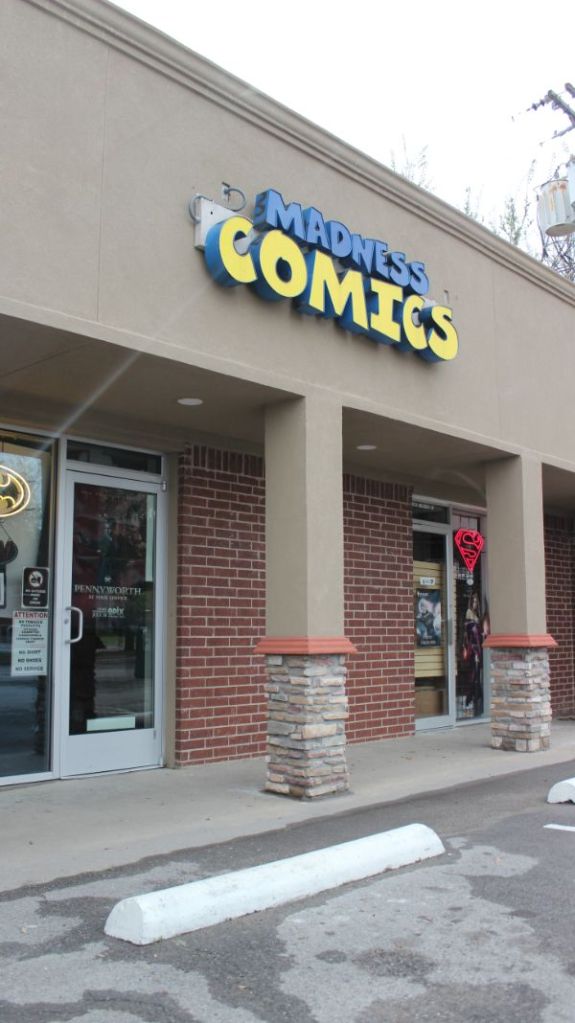 Storefront of Madness Comics and Games, one of many geek places in Denton