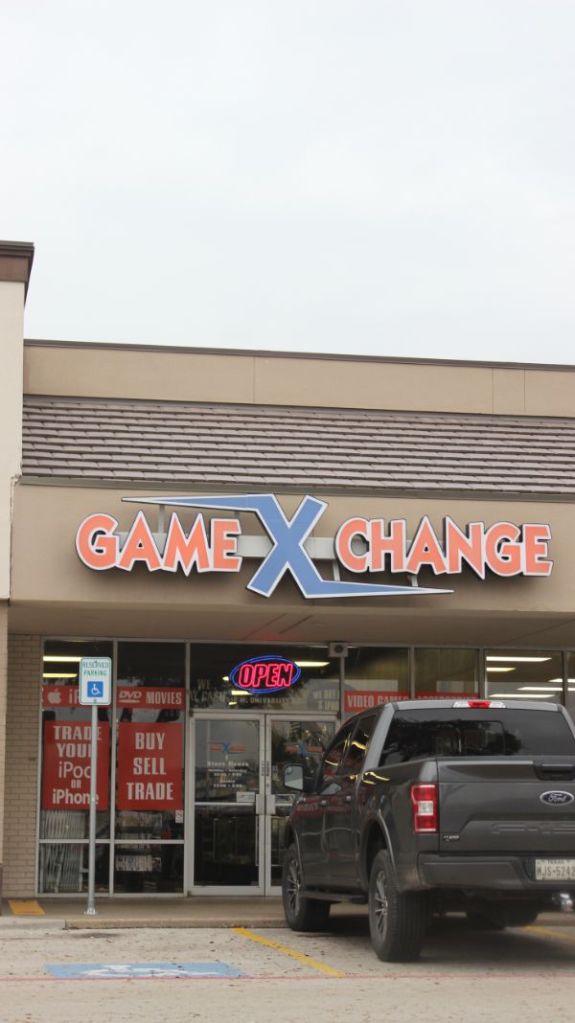 Storefront of Game X Change, one of many geek places in Denton to check out