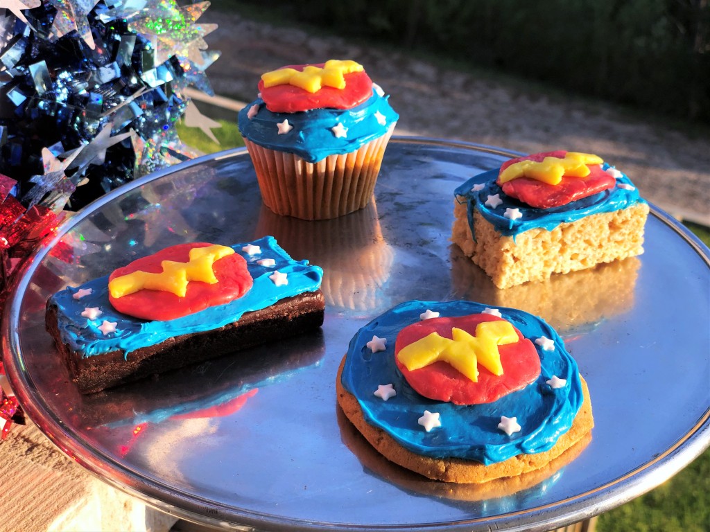 Starburst Wonder Woman candy toppers used on brownies, cookies, a Rice Krispies treat, and a cupcake